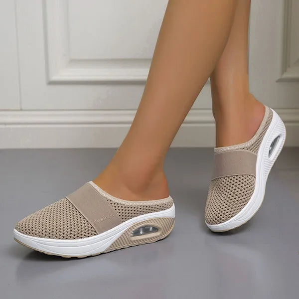 Beige backless slip-on knit sneakers with white sole and oval side detail