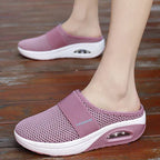 Pink backless slip-on knit sneakers with white sole and oval window detail