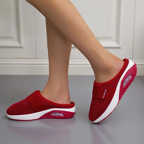 Red backless slip-on knit sneakers with white sole and oval side detail