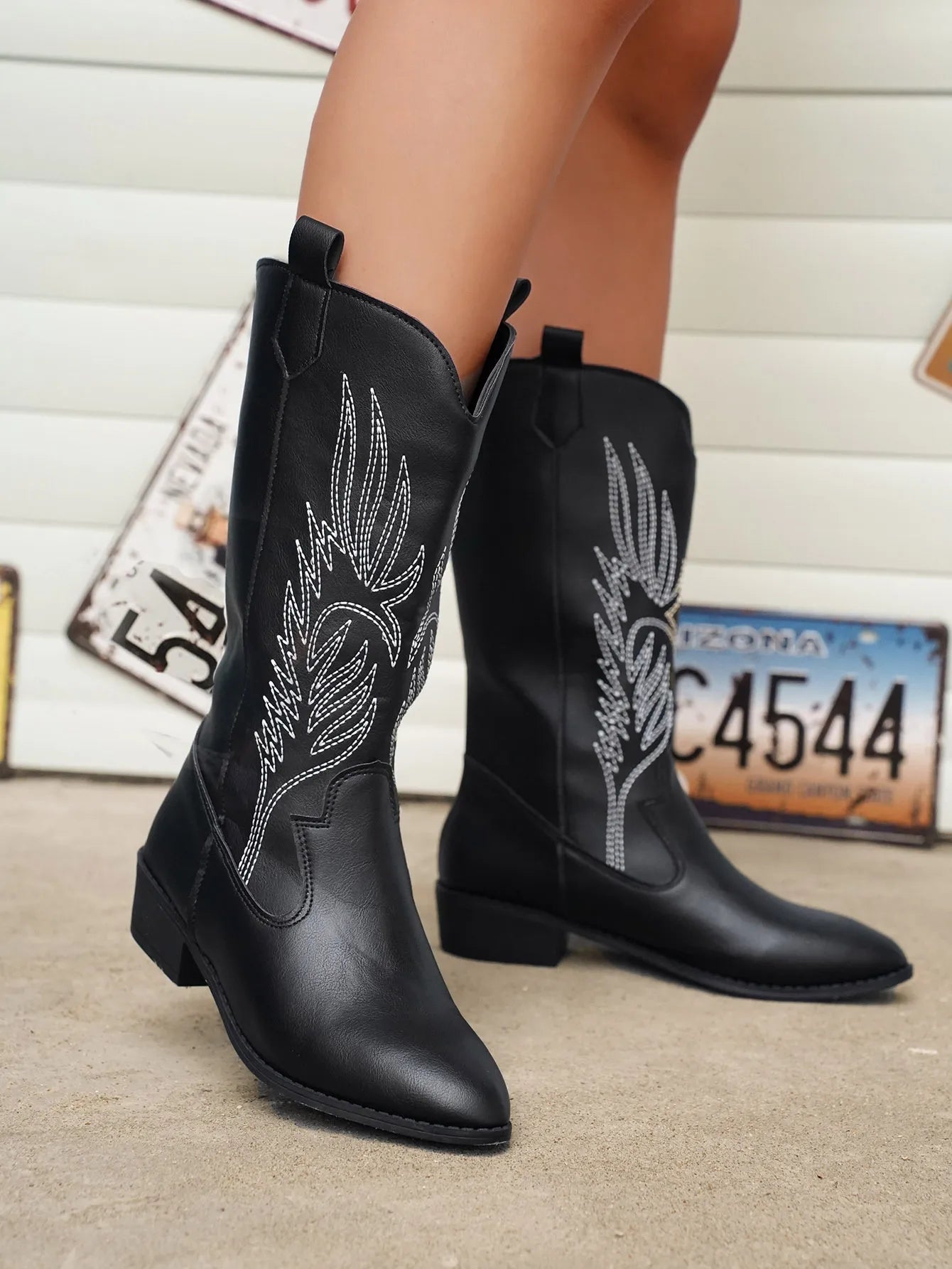 Black cowboy boots with western embroidered leaf pattern and block heel