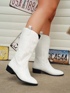 White cowboy boots with western stitched detailing and block heel