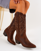 Brown cowboy boots with floral embroidered stitching and pull tab, block heel