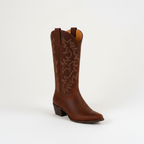 Brown cowboy boot with ornate floral stitching, low block heel and pull tab