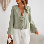 Women's deep V-neck bell sleeve top front in sage green with tie bow