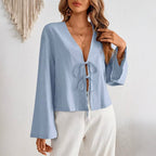 Women's deep V-neck bell sleeve top in light blue with bow-tie front