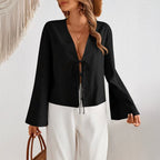 Women's deep V-neck bell sleeve top in black with tie bow detail