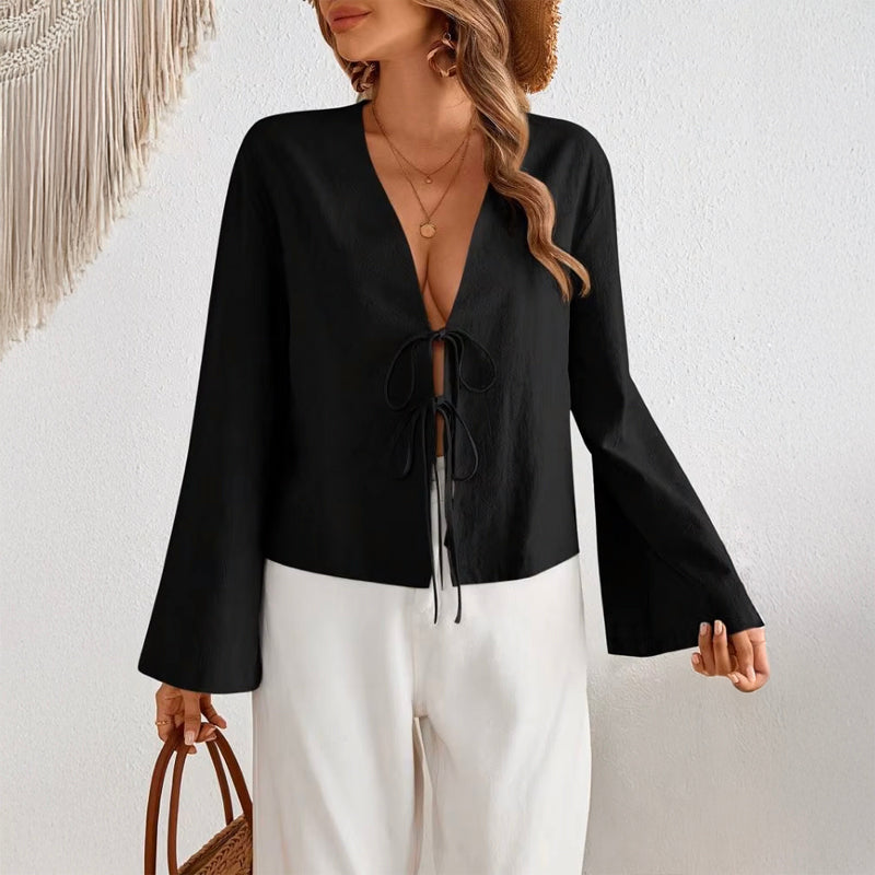 Women's deep V-neck bell sleeve top in black with tie bow detail