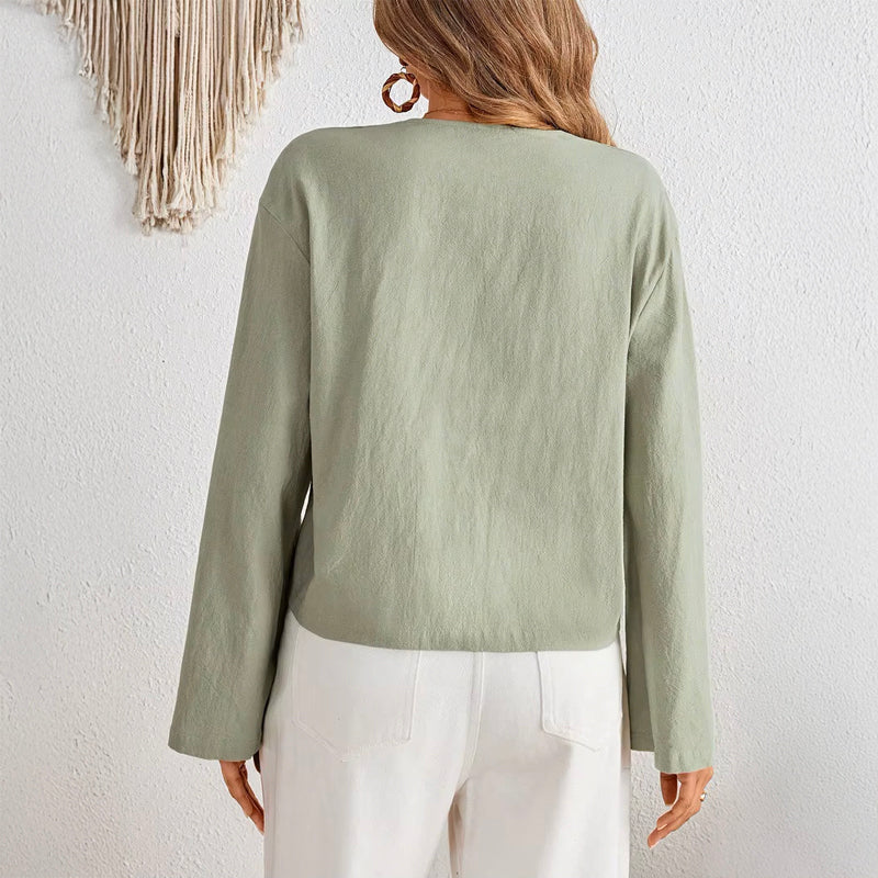 Women's deep V-neck bell sleeve top back view in sage green