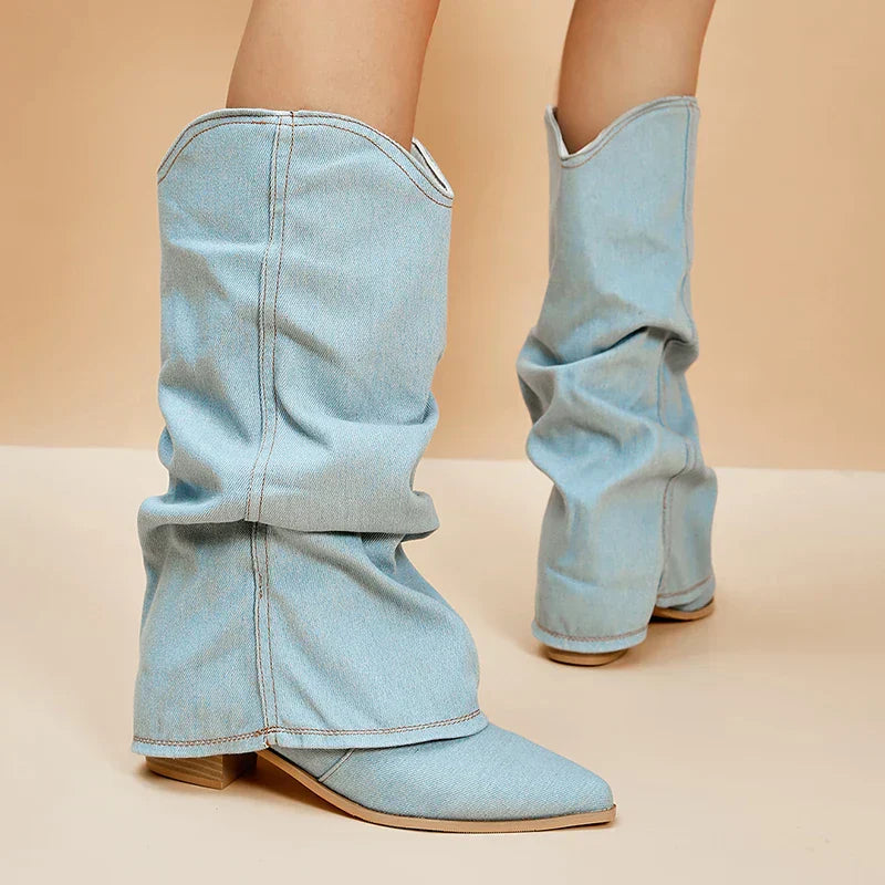 Blue denim fold-over knee-high boots with pointed toe and stacked heel