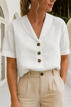 White linen blouse with shawl collar, short sleeves, button front