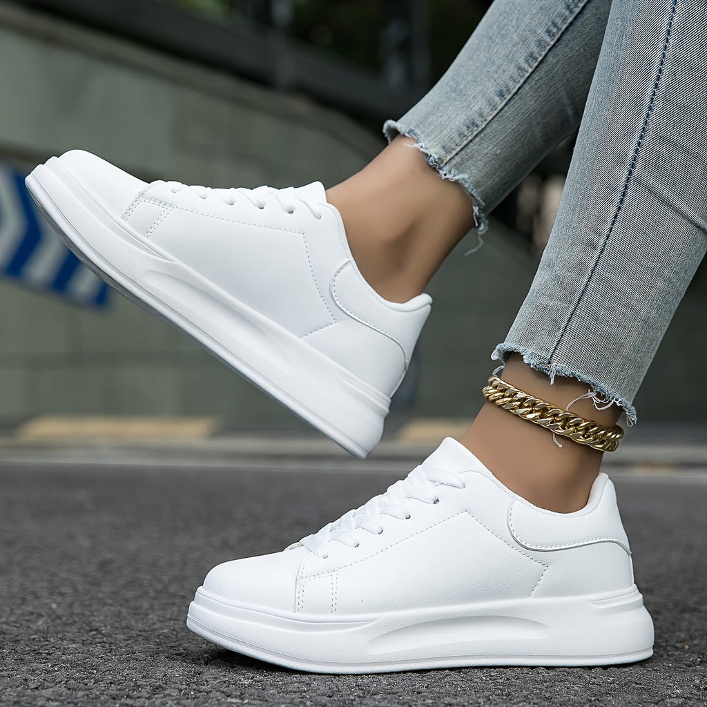 Women's white lace-up trainers, thick sole, front quarter view