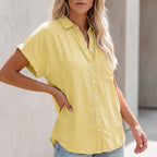 Yellow button-up blouse with collar, front buttons, chest pocket, short sleeves