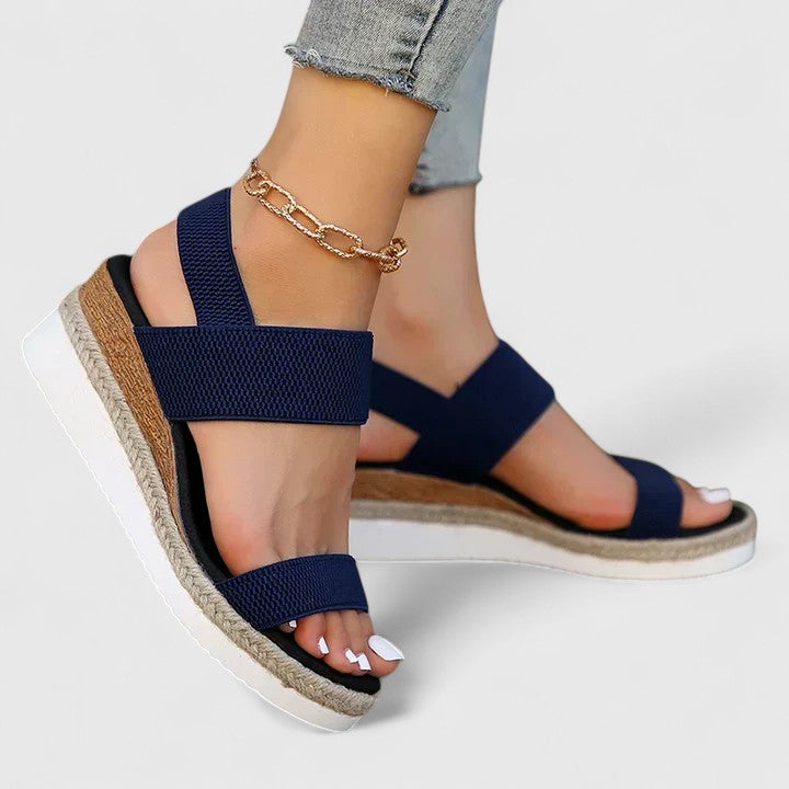 Navy two-strap platform sandals with open toe and jute-edged sole