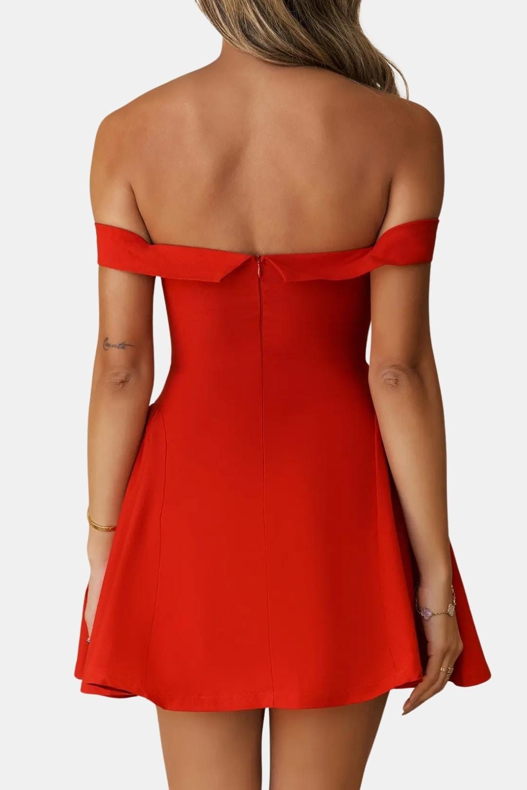Red off-shoulder mini dress with flared skirt, open-back straps and back seam detail