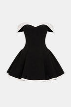 Black off-shoulder mini dress with flared skirt and white trim around neckline and hem