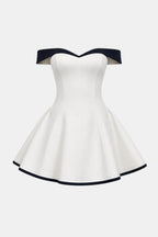 Off-shoulder sculpted mini dress with flared skirt, white with black trim.