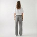 Unisex baggy joggers in gray with elastic waistband, drawstring, and relaxed legs