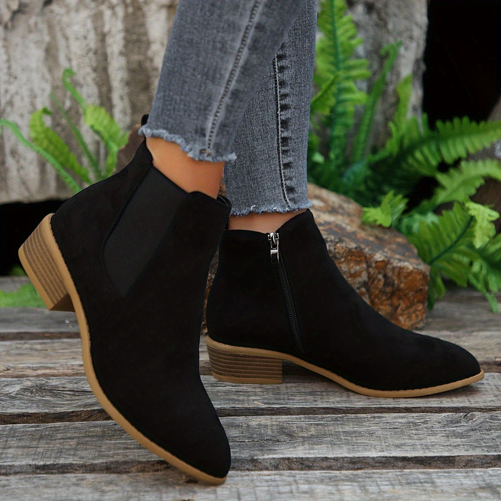 Black suede ankle boots with elastic side panels and low stacked heel