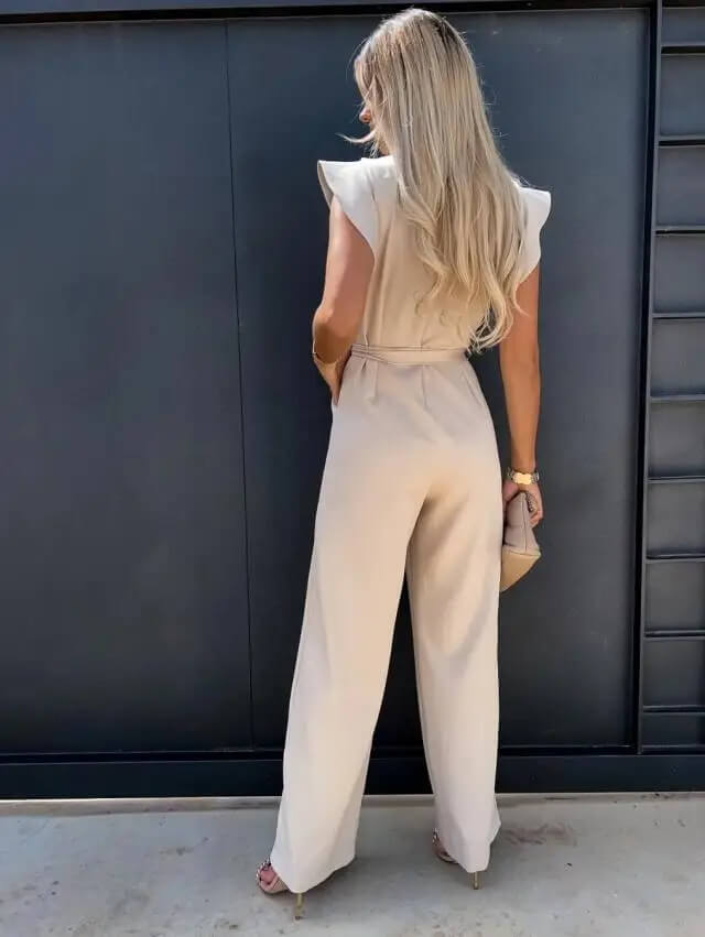 Beige wide-leg jumpsuit with flutter sleeves and tied waist belt, back view
