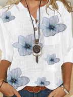 White floral button-front 3/4 sleeve blouse with light blue flower print