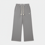 Unisex gray baggy joggers with drawstring waist, side pockets, and star logo