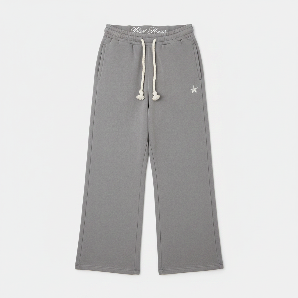 Unisex gray baggy joggers with drawstring waist, side pockets, and star logo