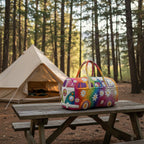 Colorful quilted travel bag with flower and peace sign patchwork on a standing frame