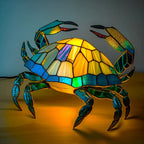 Crab-shaped stained-glass table lamp with multicolor glowing shell and claws