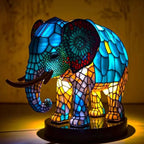 Elephant mosaic stained-glass table lamp with colorful blue and gold glow