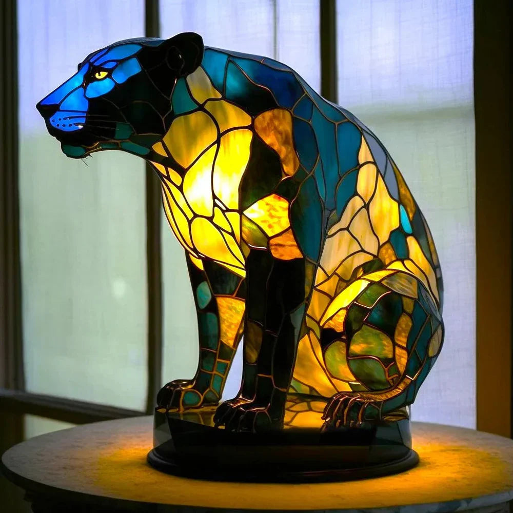 Panther-shaped stained-glass table lamp with dark and teal glowing light