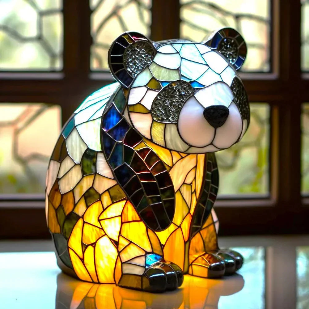 Panda-shaped stained-glass table lamp with glowing light through colored panels