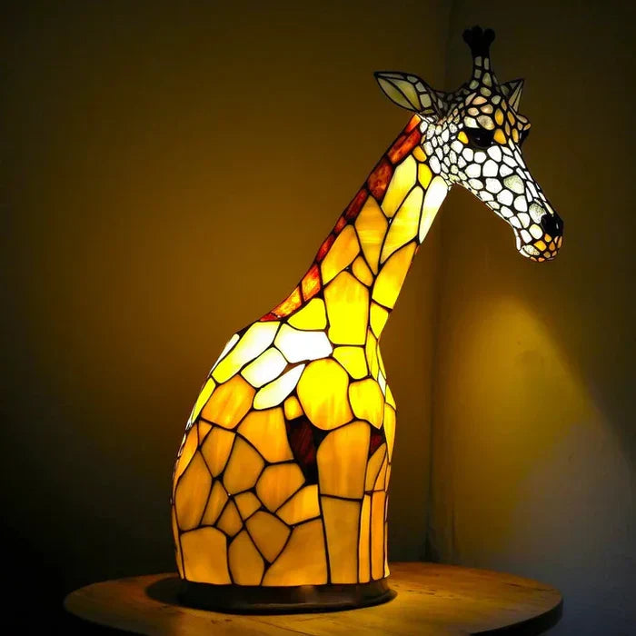 Giraffe-shaped stained-glass table lamp with warm glowing yellow panels