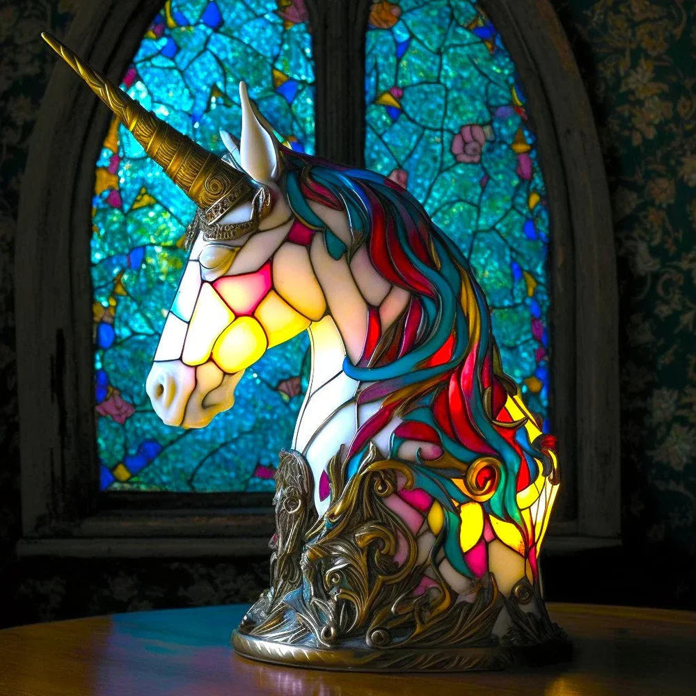 Unicorn-shaped stained-glass table lamp with red-and-blue mane and glowing light