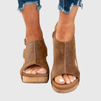 Brown open-toe wedge sandals with cushioned sole and ankle strap