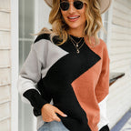 Women’s patchwork sweater with round neck, black and gray with rust orange panel detail