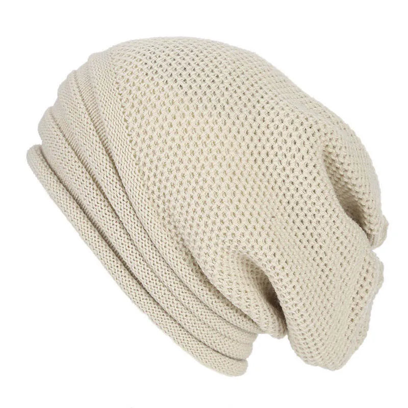 Beige knitted beanie with textured stitch and fold-over cuff