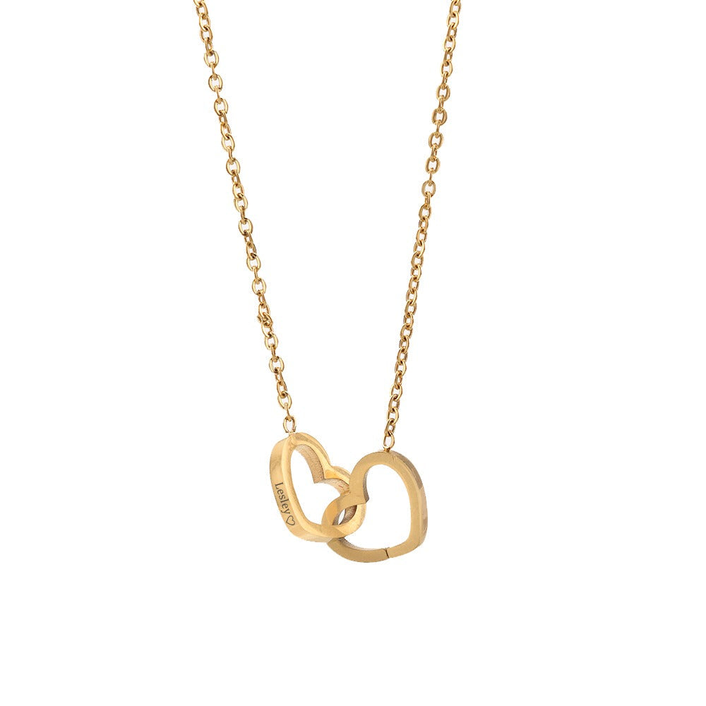 Gold heart pendant necklace with small linked chain, openwork double-heart design