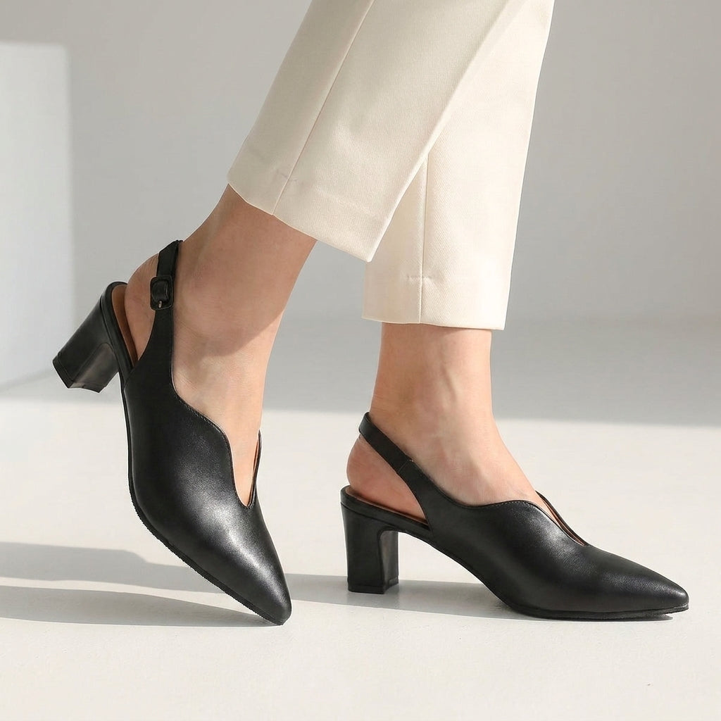 Black pointed toe slingback sandals with block heel and sling strap