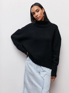 Black knitted turtleneck sweater with long sleeves and ribbed collar