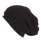 Black knitted beanie with fold-over cuff and textured stitch pattern