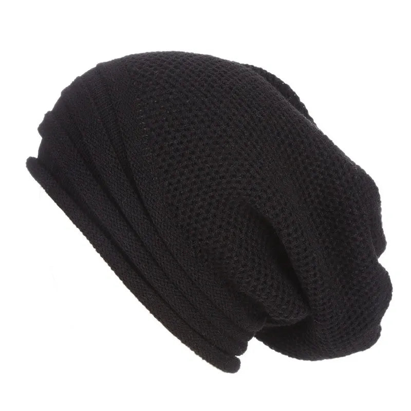 Black knitted beanie with fold-over cuff and textured stitch pattern