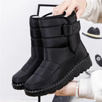 Quilted mid-calf boots in black, buckle strap detail, chunky textured sole