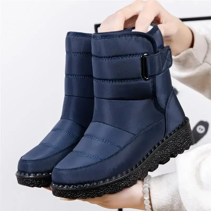 Quilted mid-calf boots in dark blue, side pull tab, chunky textured sole