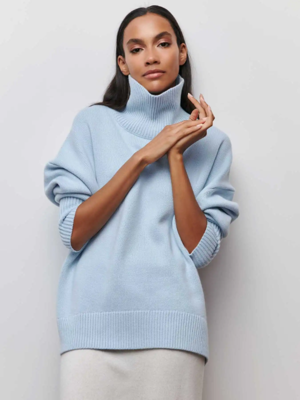 Light blue knitted turtleneck sweater with long sleeves and ribbed cuffs and hem