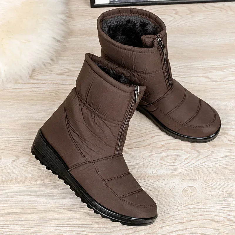 Women's brown quilted mid-calf pull-on boots with side zipper and rubber tread