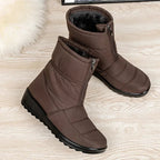 Women's brown quilted mid-calf pull-on boots with side zipper and rubber tread