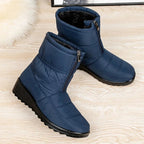Women's blue quilted mid-calf pull-on boots with side zipper and thick tread