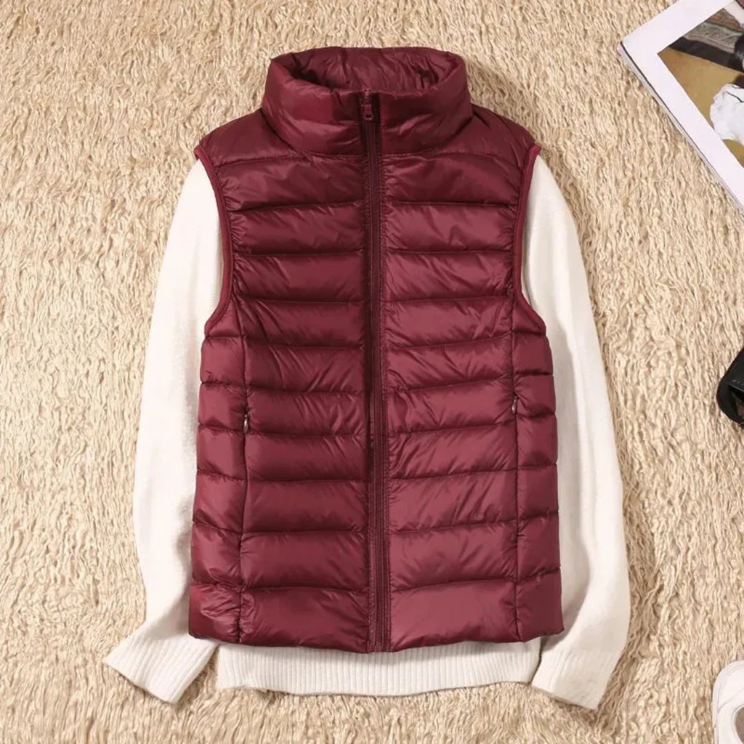 Ultralight quilted bodywarmer in burgundy, sleeveless, full-zip with stand collar
