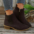 Dark brown suede ankle boots with elastic side panels and low stacked heel
