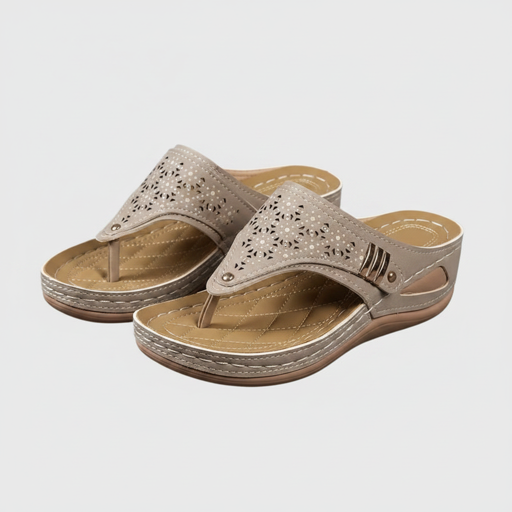 Women's wedge sandals pair in light taupe, perforated straps on tan wedge sole